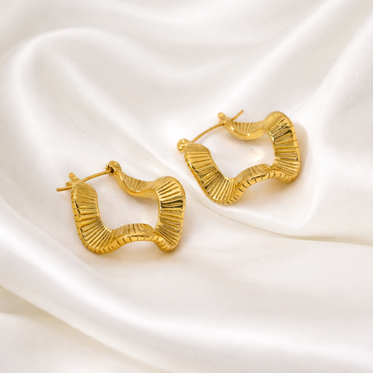 gold sculptural hoop earrings