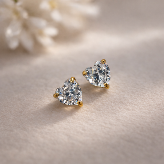 Elegant gold earrings with heart stones